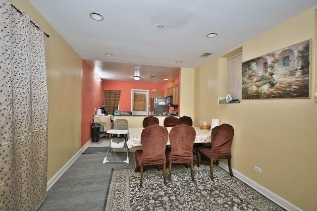 6237 N Mozart St, Chicago, IL 60659 - dining space with recessed lighting, visible vents, and baseboards