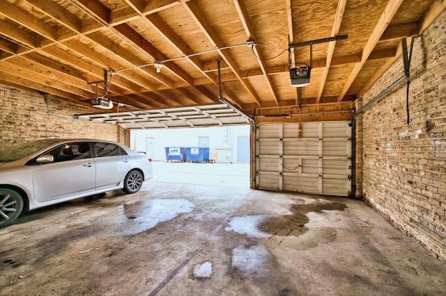 6237 N Mozart St, Chicago, IL 60659 - garage featuring a garage door opener