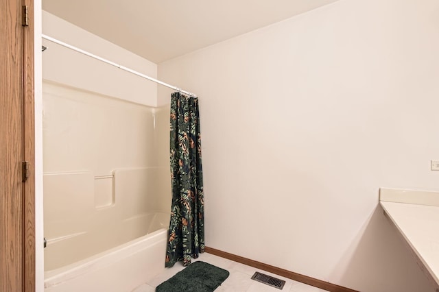 full bathroom with visible vents, baseboards, shower / bathtub combination with curtain, and tile patterned flooring