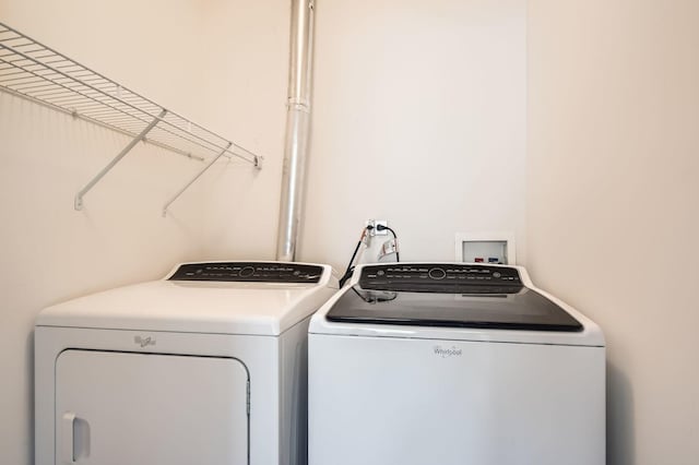 washroom with laundry area and washer and clothes dryer