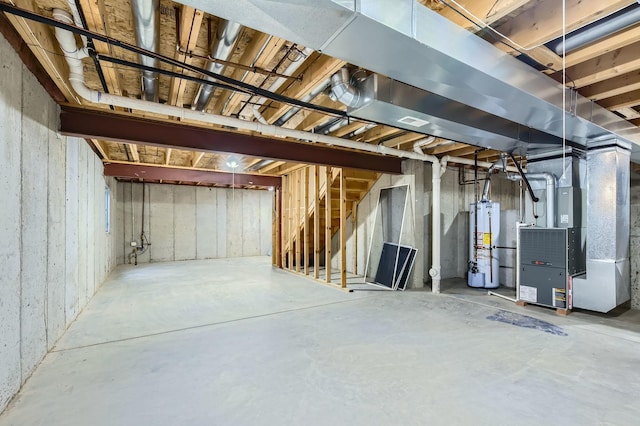 unfinished basement with stairs, heating unit, and gas water heater