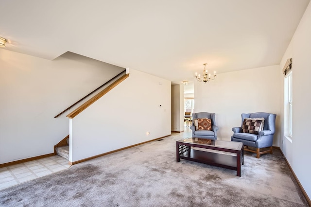living area with carpet floors, a notable chandelier, baseboards, and stairs