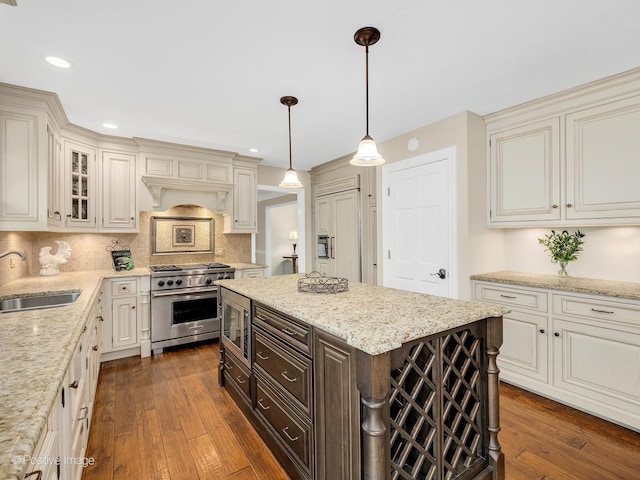 2 Stirrup Cup Ct, Saint Charles, IL 60174 - kitchen with stainless steel appliances, a sink, dark brown cabinetry, glass insert cabinets, and dark wood-style floors
