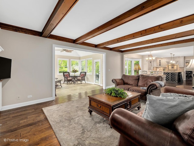 2 Stirrup Cup Ct, Saint Charles, IL 60174 - living room featuring baseboards, a chandelier, beamed ceiling, dark wood-style flooring, and a ceiling fan