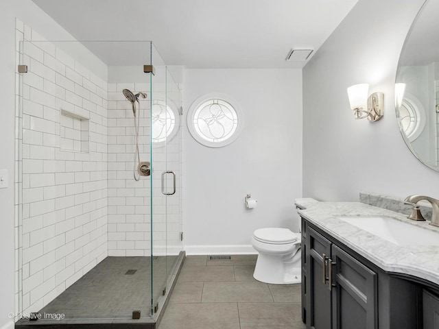 2 Stirrup Cup Ct, Saint Charles, IL 60174 - full bathroom featuring vanity, a stall shower, tile patterned flooring, toilet, and baseboards