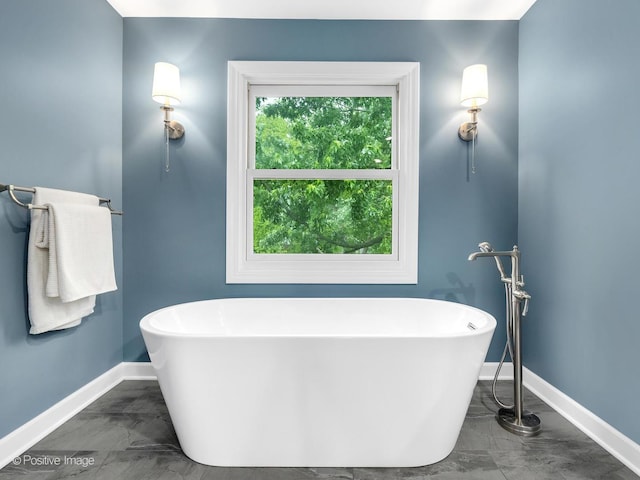 2 Stirrup Cup Ct, Saint Charles, IL 60174 - bathroom with baseboards, a soaking tub, and marble finish flooring