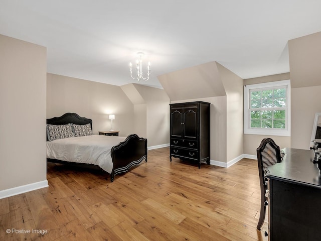 2 Stirrup Cup Ct, Saint Charles, IL 60174 - bedroom featuring light wood-style floors, a chandelier, and baseboards