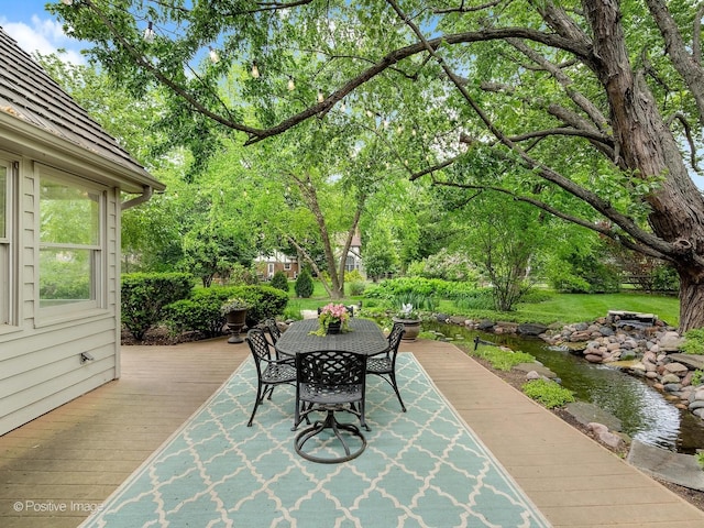 2 Stirrup Cup Ct, Saint Charles, IL 60174 - view of patio with a wooden deck and outdoor dining area