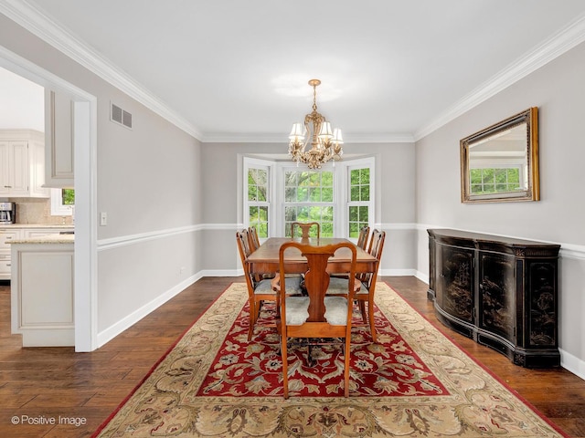 2 Stirrup Cup Ct, Saint Charles, IL 60174 - dining space featuring a chandelier, ornamental molding, dark wood-style flooring, and baseboards