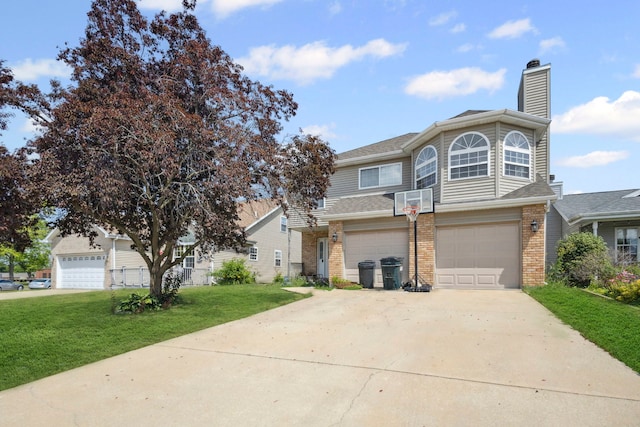 175 Mulberry St, Manteno, IL 60950 - view of front of property featuring brick siding, a front lawn, driveway, a chimney, and a garage