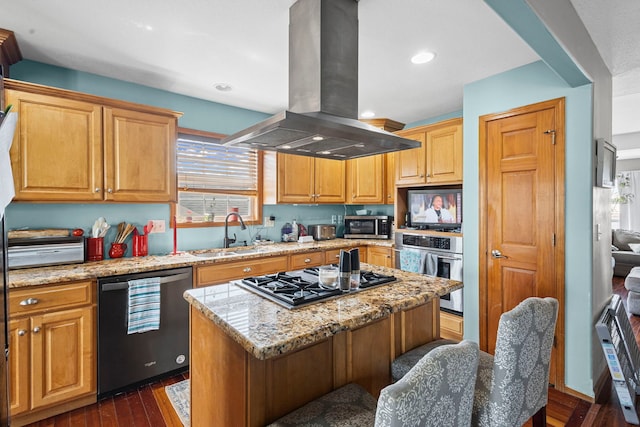175 Mulberry St, Manteno, IL 60950 - kitchen with island exhaust hood, stainless steel appliances, dark wood-type flooring, healthy amount of natural light, and recessed lighting
