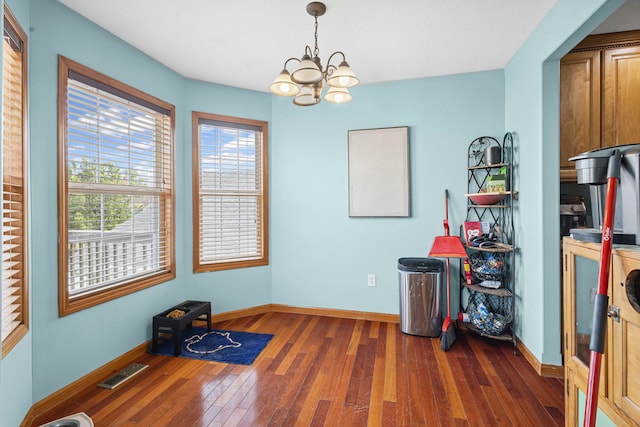 175 Mulberry St, Manteno, IL 60950 - dining area featuring hardwood / wood-style flooring and a chandelier