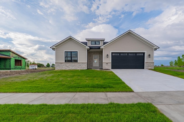 2538 Marble Rd, Normal, IL 61761 - view of front of house with concrete driveway, stone siding, a front lawn, and a garage