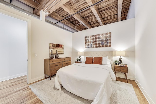 bedroom featuring wood finished floors and baseboards