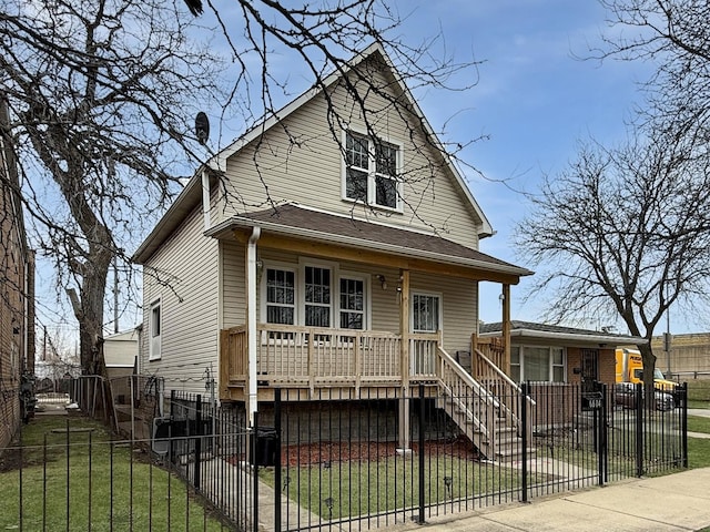 bungalow-style house featuring covered porch, a fenced front yard, and a front yard