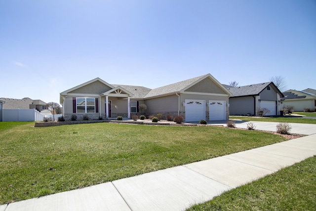 view of front of property featuring a garage, stone siding, fence, a front lawn, and driveway