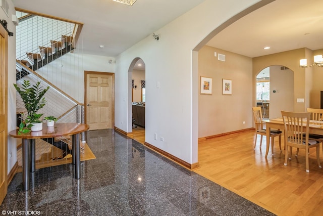 905 Basswood St, Hoffman Estates, IL 60169 - dining room with baseboards, granite floors, recessed lighting, and arched walkways