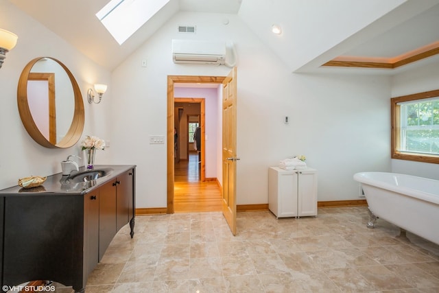 905 Basswood St, Hoffman Estates, IL 60169 - full bath featuring a skylight, a wall unit AC, a freestanding bath, vanity, and high vaulted ceiling