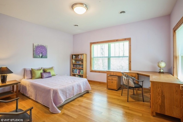 905 Basswood St, Hoffman Estates, IL 60169 - bedroom featuring light wood-type flooring and baseboards