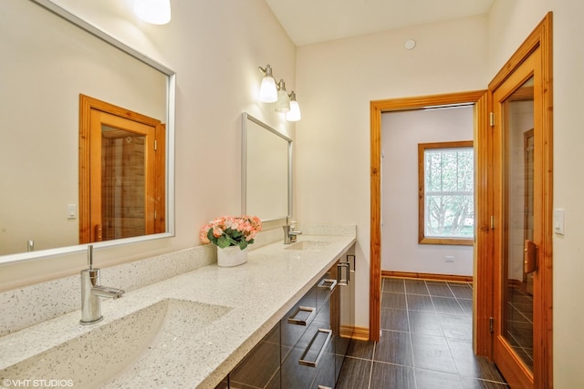 905 Basswood St, Hoffman Estates, IL 60169 - full bath featuring tile patterned floors, double vanity, and baseboards