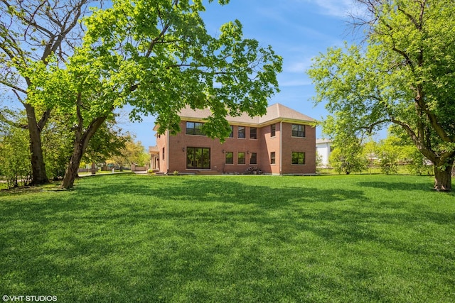 905 Basswood St, Hoffman Estates, IL 60169 - rear view of property with a lawn