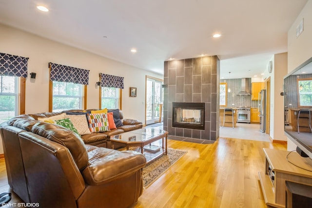 905 Basswood St, Hoffman Estates, IL 60169 - living area with light wood finished floors, recessed lighting, and a tile fireplace