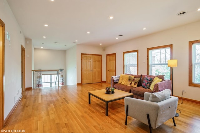 905 Basswood St, Hoffman Estates, IL 60169 - living area with light wood-type flooring, healthy amount of natural light, recessed lighting, and baseboards