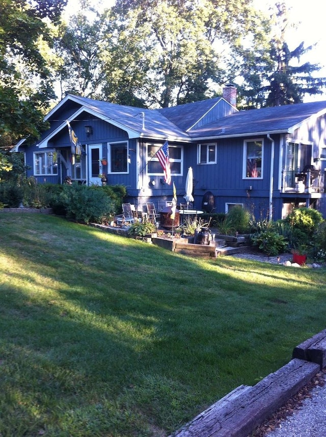 401 Woodbine Rd, Cary, IL 60013 - back of house featuring a yard and a chimney