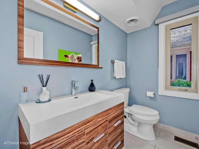 bathroom with toilet, visible vents, tile patterned flooring, and vanity