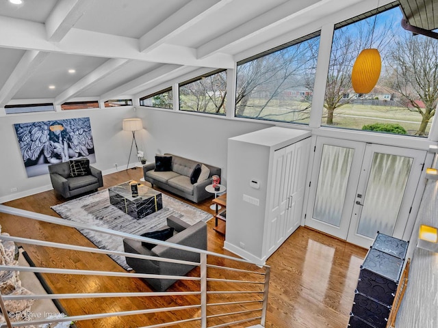 living room featuring baseboards, recessed lighting, beam ceiling, and wood finished floors