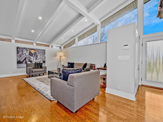 living area with baseboards, vaulted ceiling with beams, recessed lighting, and wood finished floors