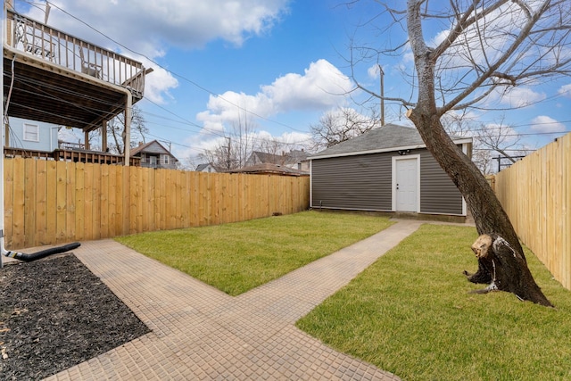 view of yard with an outbuilding and a fenced backyard