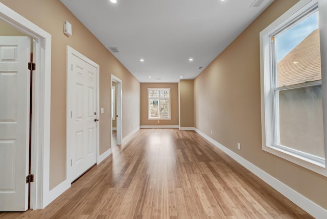 foyer entrance with light wood-type flooring, recessed lighting, baseboards, and visible vents