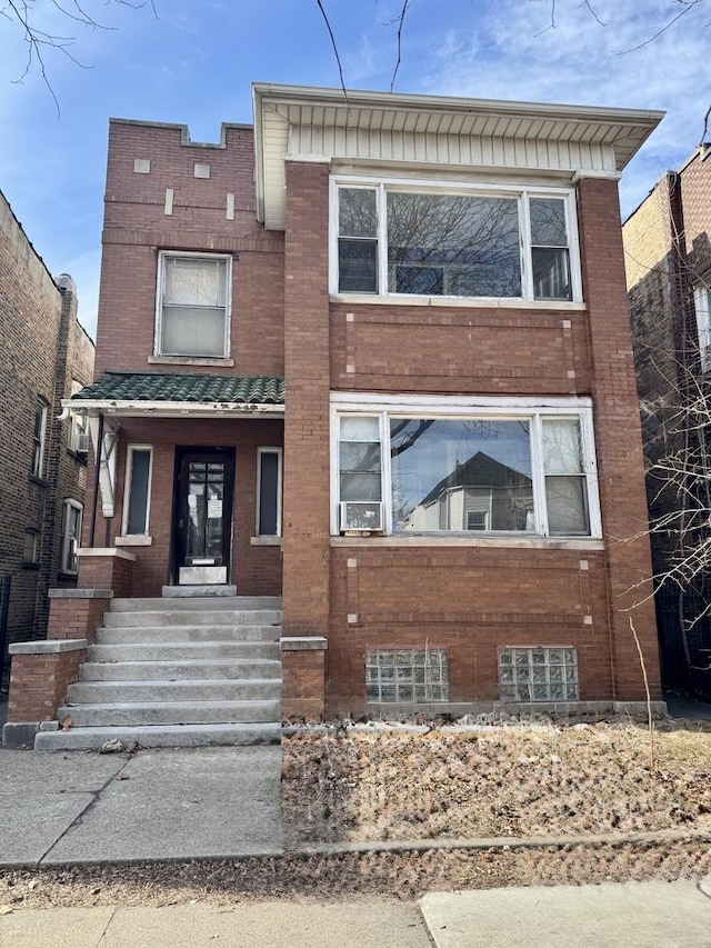 view of front of home featuring brick siding