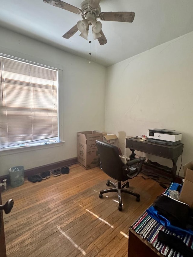 office space with hardwood / wood-style floors, baseboards, and ceiling fan