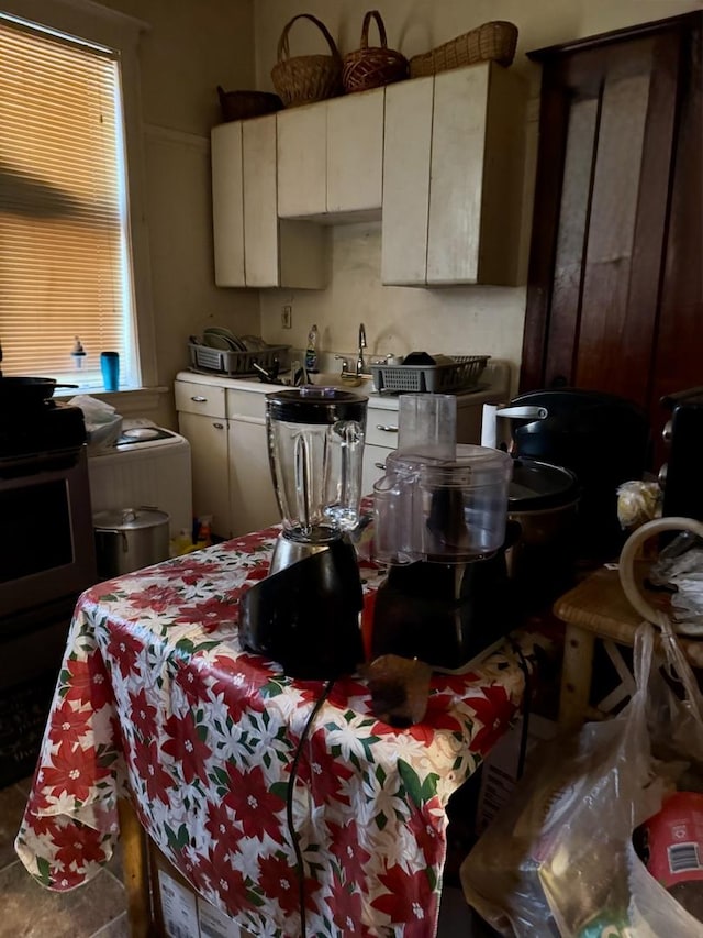 kitchen featuring light countertops and electric range