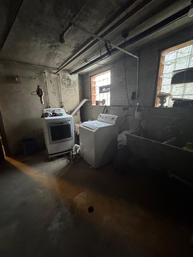 below grade area featuring washer / clothes dryer and a healthy amount of sunlight