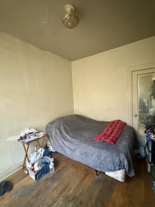bedroom featuring wood finished floors