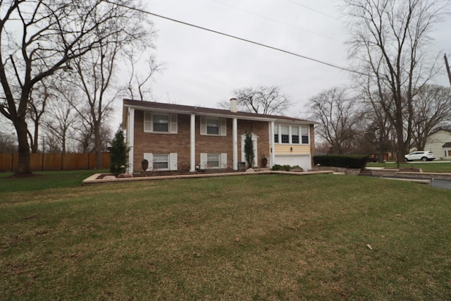 20301 Fairfield Ave, Olympia Fields, IL 60461 - raised ranch featuring an attached garage, brick siding, fence, and a front yard