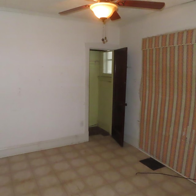 4938 W Wrightwood Ave, Chicago, IL 60639 - empty room with ceiling fan and light floors