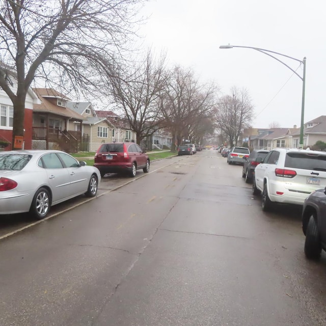 4938 W Wrightwood Ave, Chicago, IL 60639 - view of street featuring a residential view and street lights