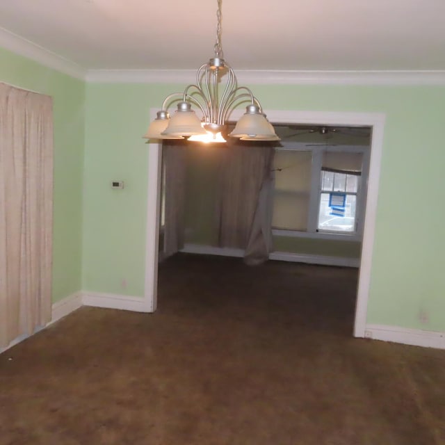 4938 W Wrightwood Ave, Chicago, IL 60639 - unfurnished dining area with ornamental molding, baseboards, dark colored carpet, and a chandelier