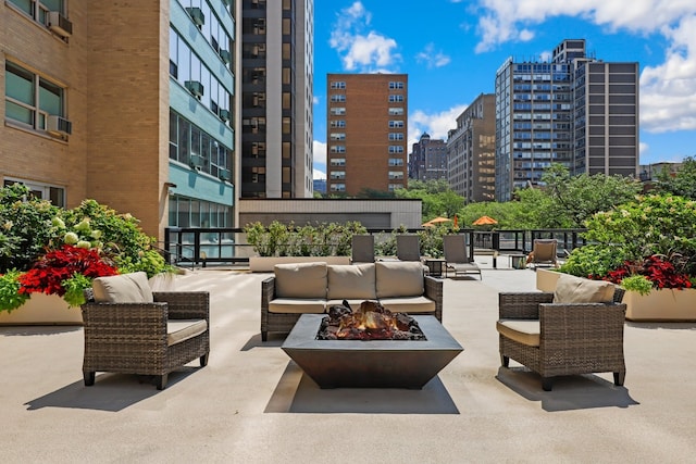 3180 N Lake Shore Dr Unit 15A, Chicago, IL 60657 - view of patio with a view of city and an outdoor living space with a fire pit