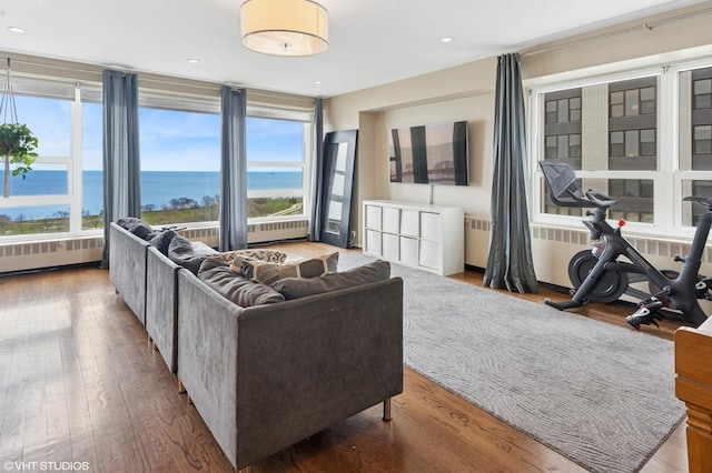 3180 N Lake Shore Dr Unit 15A, Chicago, IL 60657 - living area with recessed lighting, radiator, a water view, and wood finished floors