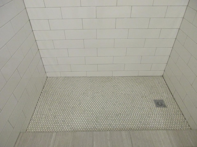interior space with a tile shower