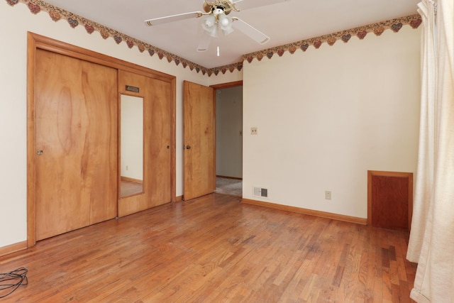 108 N Chatham St, Danvers, IL 61732 - unfurnished bedroom with baseboards, light wood finished floors, ceiling fan, visible vents, and a closet