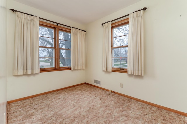 108 N Chatham St, Danvers, IL 61732 - unfurnished room featuring baseboards, carpet floors, and visible vents