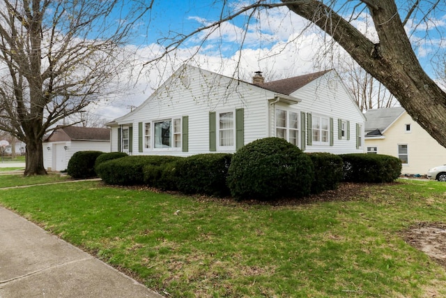 108 N Chatham St, Danvers, IL 61732 - view of property exterior with a chimney and a lawn