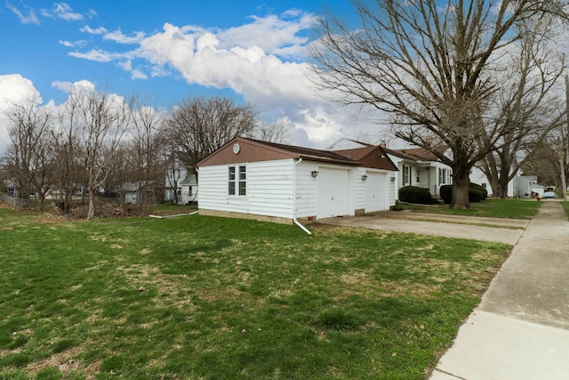 108 N Chatham St, Danvers, IL 61732 - view of home's exterior with a lawn, concrete driveway, and an attached garage