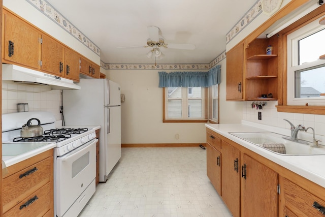 108 N Chatham St, Danvers, IL 61732 - kitchen featuring a ceiling fan, light floors, under cabinet range hood, a sink, and gas range gas stove